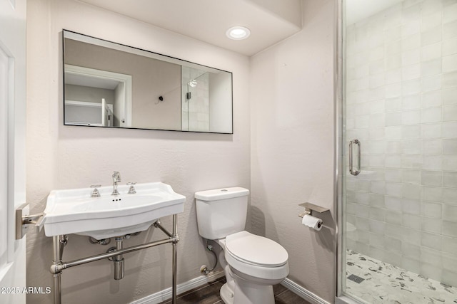 7439 E Beryl Ave, Scottsdale, AZ 85258 - full bathroom with a shower stall, toilet, a sink, baseboards, and wood finished floors