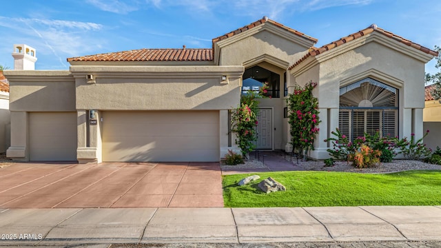 7439 E Beryl Ave, Scottsdale, AZ 85258 - mediterranean / spanish house featuring an attached garage, stucco siding, concrete driveway, and a tile roof