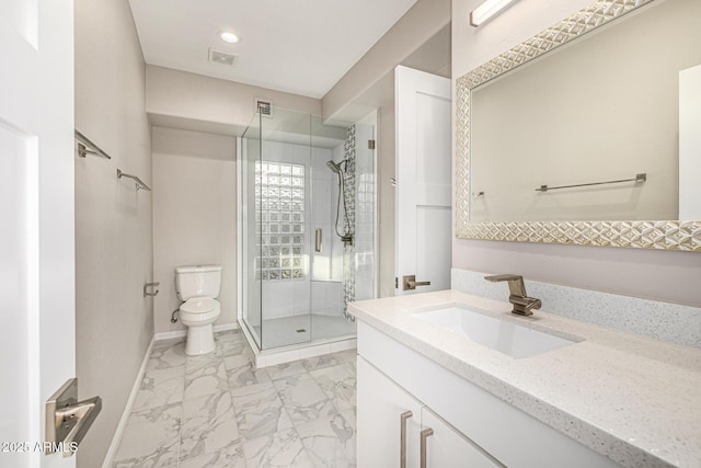 7439 E Beryl Ave, Scottsdale, AZ 85258 - full bathroom with marble look tile flooring, vanity, toilet, a shower stall, and baseboards