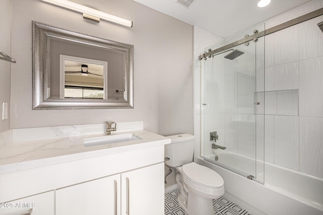 7439 E Beryl Ave, Scottsdale, AZ 85258 - full bathroom with vanity, combined bath / shower with glass door, and toilet