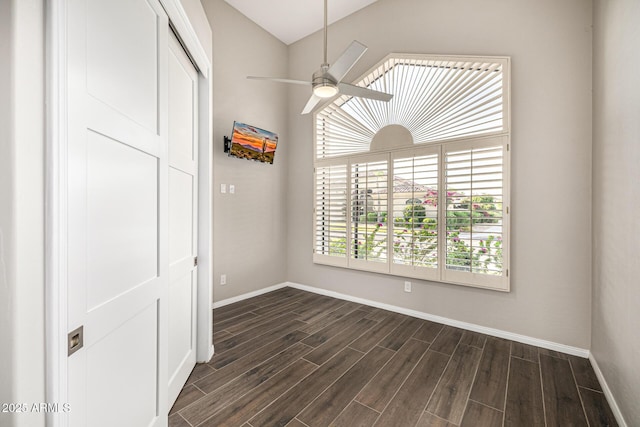 7439 E Beryl Ave, Scottsdale, AZ 85258 - spare room featuring dark wood-style floors, baseboards, ceiling fan, and vaulted ceiling