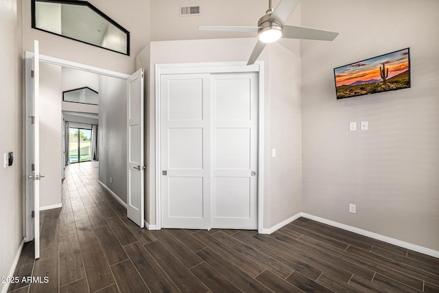 7439 E Beryl Ave, Scottsdale, AZ 85258 - unfurnished bedroom with dark wood finished floors, baseboards, and a closet