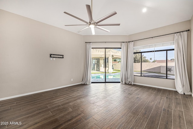 7439 E Beryl Ave, Scottsdale, AZ 85258 - empty room featuring baseboards, dark wood-style flooring, and ceiling fan