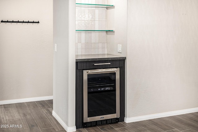 7439 E Beryl Ave, Scottsdale, AZ 85258 - detailed view of wine cooler, wood finished floors, and baseboards