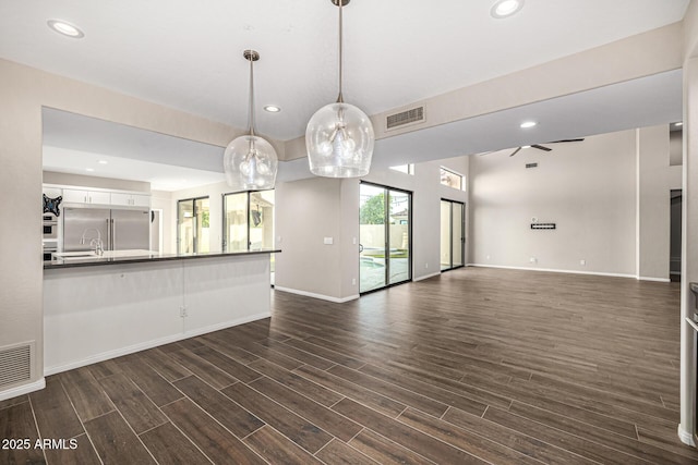 7439 E Beryl Ave, Scottsdale, AZ 85258 - unfurnished living room featuring dark wood finished floors, baseboards, recessed lighting, and ceiling fan