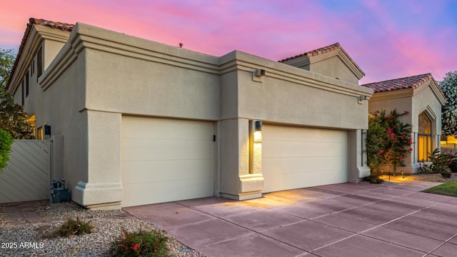 7439 E Beryl Ave, Scottsdale, AZ 85258 - view of front of home with a tile roof, stucco siding, and a garage