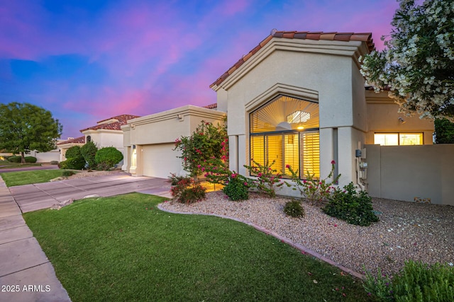 7439 E Beryl Ave, Scottsdale, AZ 85258 - mediterranean / spanish home featuring stucco siding, an attached garage, concrete driveway, and a tile roof