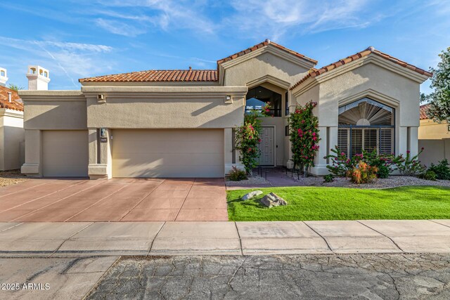 7439 E Beryl Ave, Scottsdale, AZ 85258 - mediterranean / spanish-style house featuring stucco siding, an attached garage, driveway, and a tiled roof