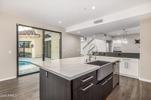 7439 E Beryl Ave, Scottsdale, AZ 85258 - kitchen with a sink, dark wood-type flooring, recessed lighting, baseboards, and stainless steel dishwasher