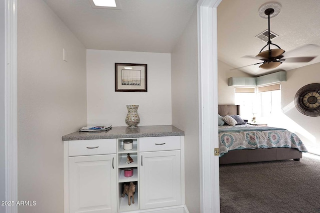 bedroom with ceiling fan and carpet flooring