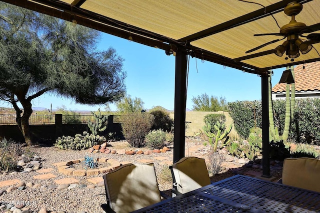 view of patio featuring ceiling fan