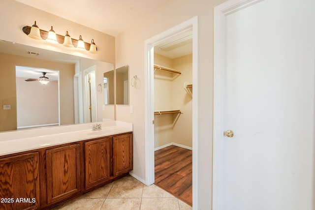 bathroom featuring vanity, ceiling fan, and tile patterned floors