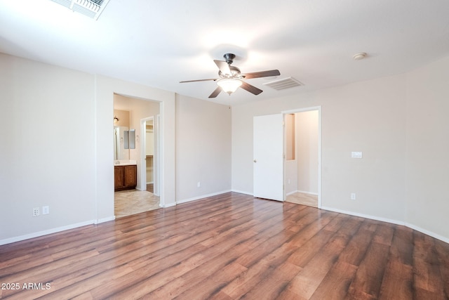 unfurnished room with hardwood / wood-style flooring and ceiling fan