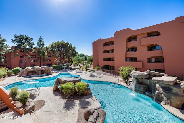 view of pool featuring pool water feature