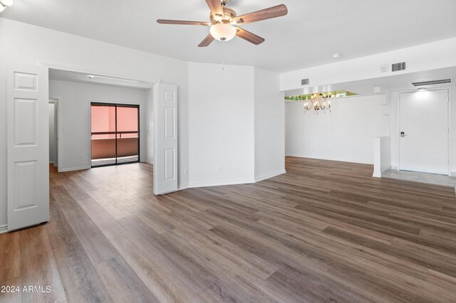 empty room featuring ceiling fan and hardwood / wood-style floors