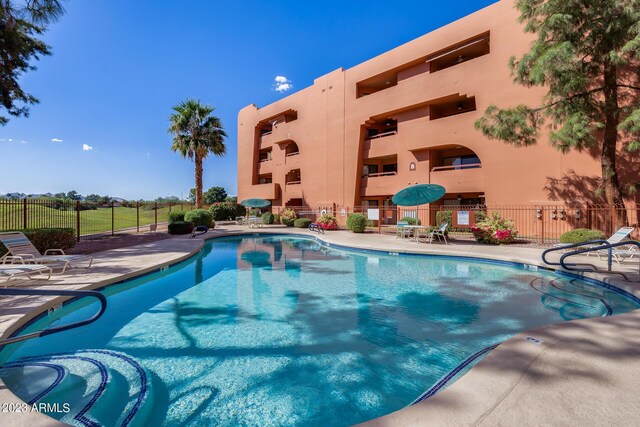 view of swimming pool with a patio area