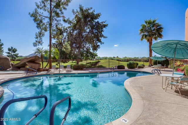 view of pool featuring a patio area