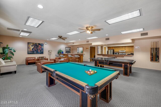 game room featuring bar area, carpet, ceiling fan, and pool table