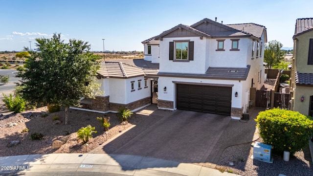 5212 S Seton Ct, Gilbert, AZ 85298 - view of front of home with decorative driveway, stone siding, stucco siding, and an attached garage