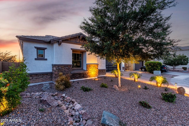 5212 S Seton Ct, Gilbert, AZ 85298 - craftsman-style home featuring stone siding, an attached garage, stucco siding, a tiled roof, and driveway