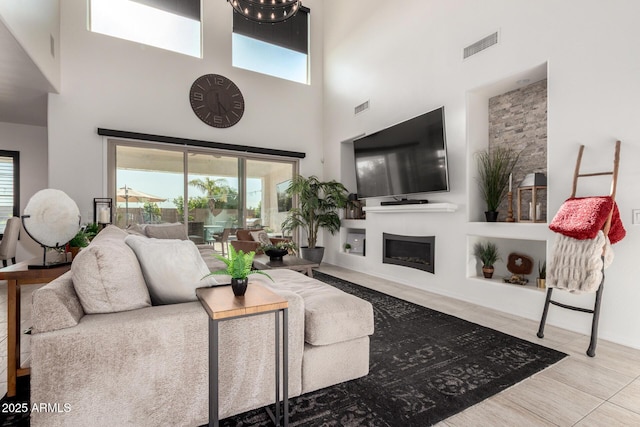 5212 S Seton Ct, Gilbert, AZ 85298 - living room with a high ceiling, plenty of natural light, and a fireplace