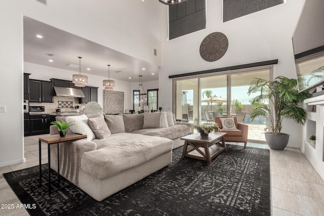 5212 S Seton Ct, Gilbert, AZ 85298 - living room with a towering ceiling, light tile patterned floors, recessed lighting, and baseboards