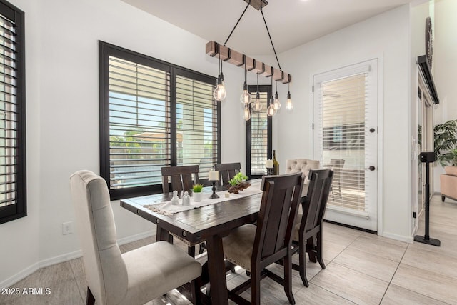 5212 S Seton Ct, Gilbert, AZ 85298 - dining space featuring healthy amount of natural light, baseboards, and light tile patterned flooring