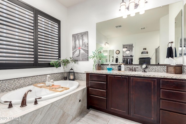 5212 S Seton Ct, Gilbert, AZ 85298 - bathroom with a garden tub, vanity, and tile patterned floors