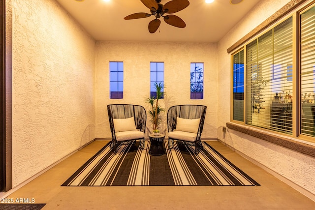 5212 S Seton Ct, Gilbert, AZ 85298 - living area featuring a textured wall, ceiling fan, and baseboards