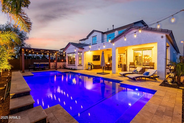 5212 S Seton Ct, Gilbert, AZ 85298 - pool at dusk featuring a pergola, a patio, and outdoor lounge area