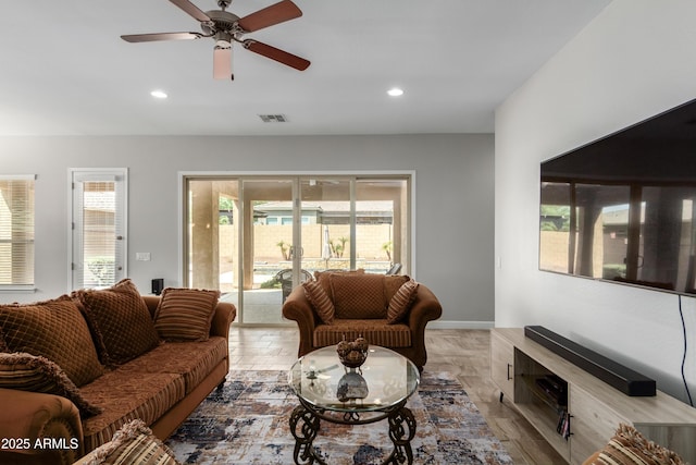 living area with visible vents, ceiling fan, a wealth of natural light, and recessed lighting