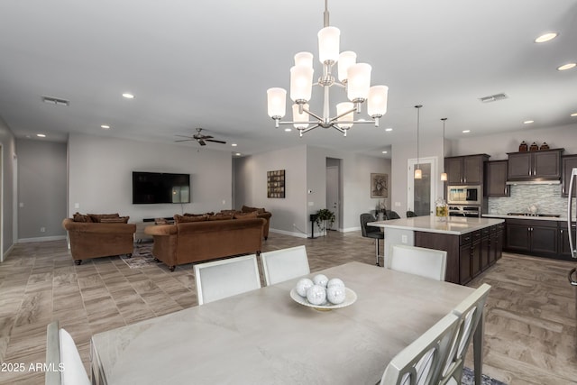 dining area with recessed lighting, visible vents, baseboards, and ceiling fan with notable chandelier