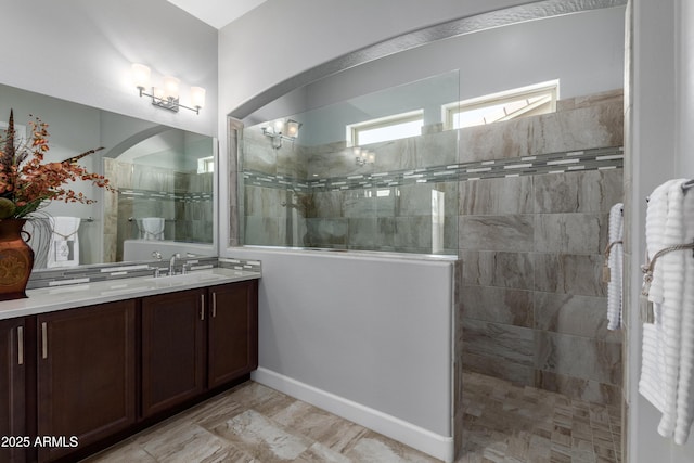 bathroom with vanity and a walk in shower