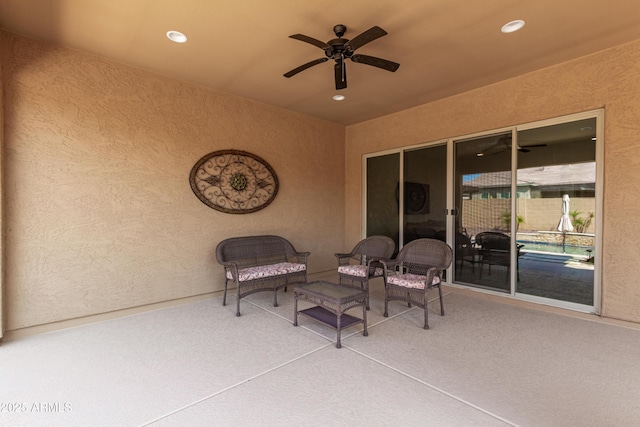 view of patio / terrace featuring fence and a ceiling fan