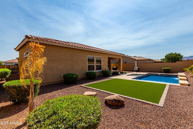 view of swimming pool featuring a patio, a fenced backyard, and a fenced in pool