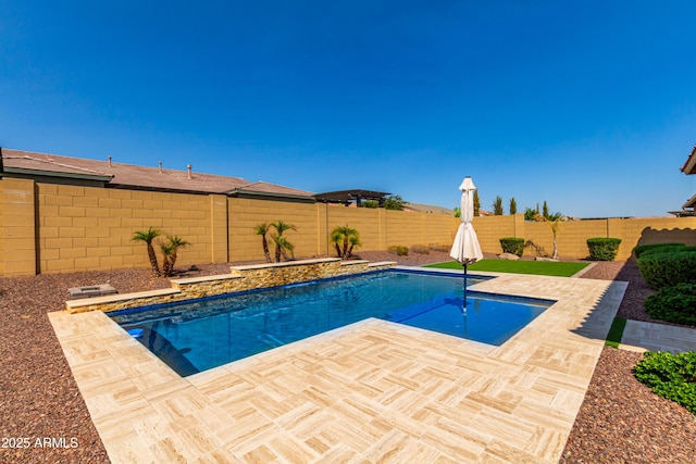 view of swimming pool featuring a fenced backyard, a patio, and a fenced in pool
