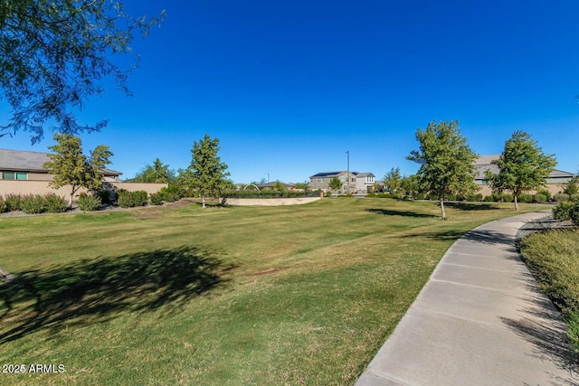 surrounding community featuring a yard