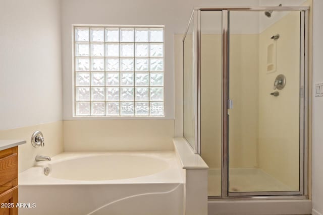 4143 E Sundance Ave, Gilbert, AZ 85297 - full bathroom featuring vanity, a bath, and a stall shower