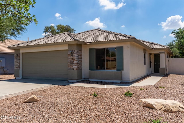 4143 E Sundance Ave, Gilbert, AZ 85297 - view of front of home with a tiled roof, a garage, concrete driveway, and stone siding