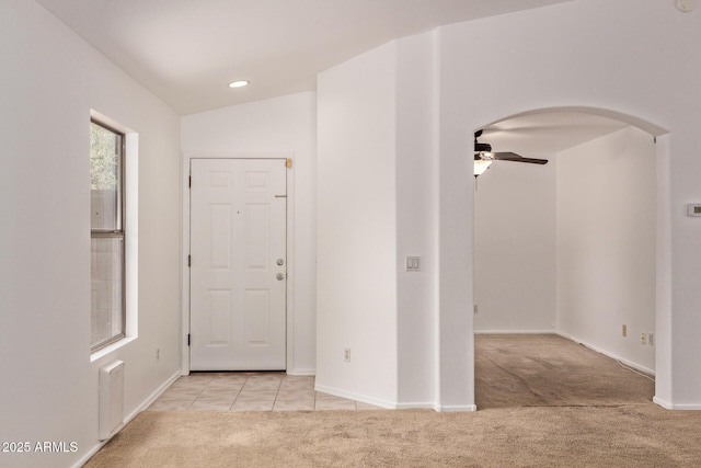 4143 E Sundance Ave, Gilbert, AZ 85297 - foyer featuring light colored carpet, ceiling fan, arched walkways, and baseboards
