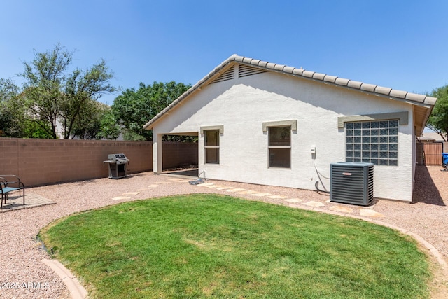 4143 E Sundance Ave, Gilbert, AZ 85297 - back of house featuring central air condition unit, stucco siding, and a patio