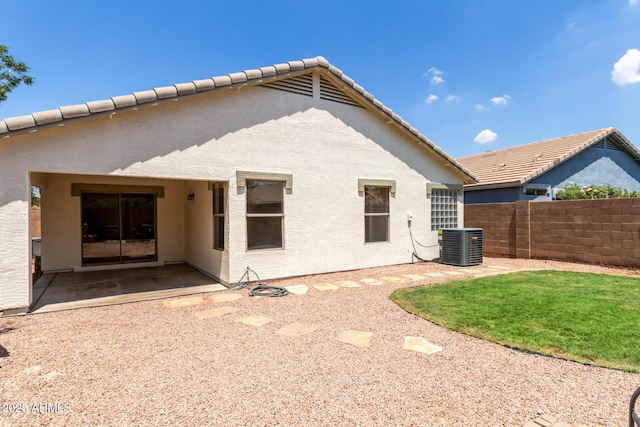 4143 E Sundance Ave, Gilbert, AZ 85297 - back of property with cooling unit, stucco siding, and a patio area