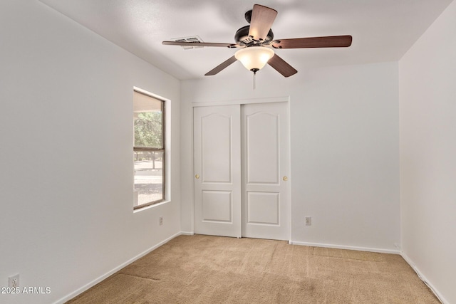 4143 E Sundance Ave, Gilbert, AZ 85297 - unfurnished bedroom with light carpet, baseboards, a closet, and a ceiling fan