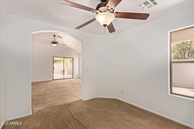 4143 E Sundance Ave, Gilbert, AZ 85297 - carpeted empty room featuring ceiling fan, arched walkways, plenty of natural light, and baseboards