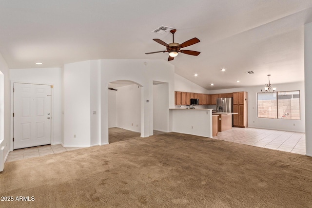 4143 E Sundance Ave, Gilbert, AZ 85297 - unfurnished living room with light carpet, light tile patterned floors, a ceiling fan, arched walkways, and recessed lighting