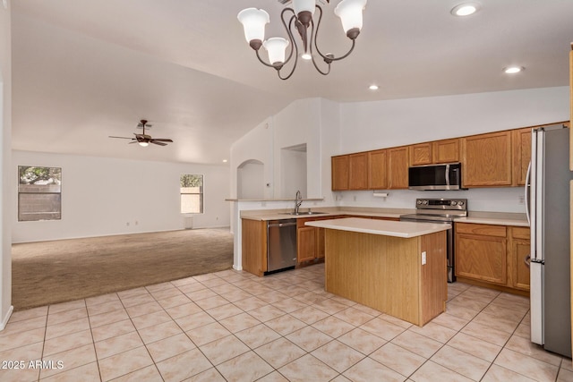 4143 E Sundance Ave, Gilbert, AZ 85297 - kitchen featuring appliances with stainless steel finishes, open floor plan, a sink, a center island, and light countertops