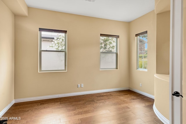 1620 E Sattoo Way, Queen Creek, AZ 85140 - spare room with wood-type flooring and baseboards