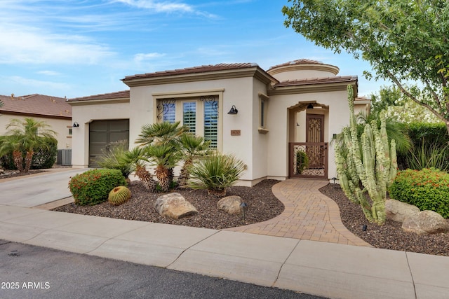 1620 E Sattoo Way, Queen Creek, AZ 85140 - mediterranean / spanish-style house with a garage, stucco siding, driveway, a tiled roof, and central AC