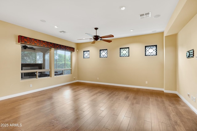 1620 E Sattoo Way, Queen Creek, AZ 85140 - unfurnished room featuring a ceiling fan, baseboards, wood finished floors, and recessed lighting