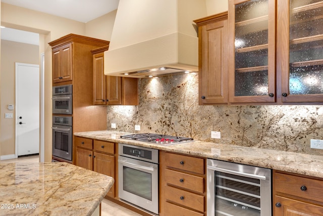 1620 E Sattoo Way, Queen Creek, AZ 85140 - kitchen featuring wine cooler, custom exhaust hood, light stone countertops, and backsplash